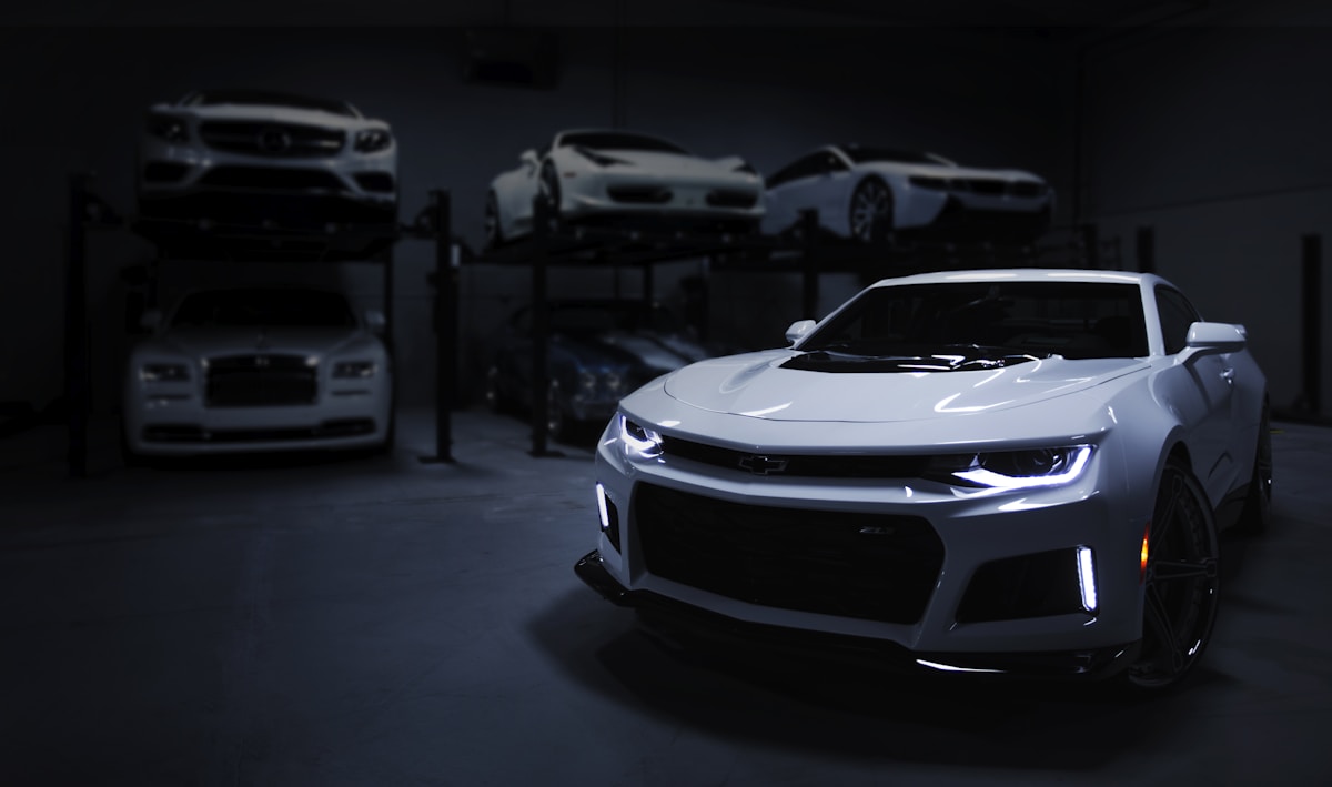 Silver performance car photographed from the front in an outdoor setting